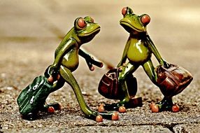 Vintage of the frog figures with the luggage