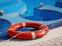 red lifebelt near the pool