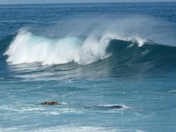 splashing blue waves in the ocean