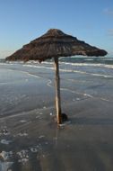 weathered beach parasol at sea