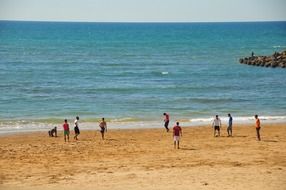 football on a sandy beach in morocco