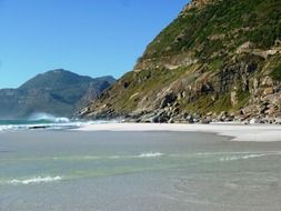 white sand beach at rocky coast, south africa, noordhoek