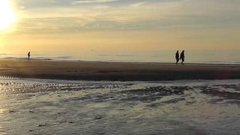 evening walk on the beach at sunset
