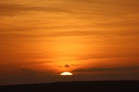 sun beyond the horizon of the ocean