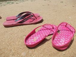 pink flip flops on the beach