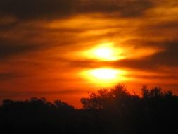 dramatic fiery sunset over the black forest