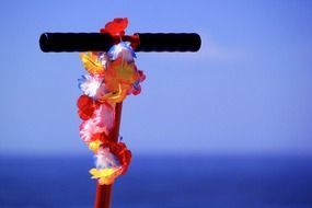 flower garland on a handlebars