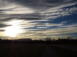 golden cirrus clouds at sunset