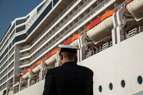 steward on the background of a cruise ship