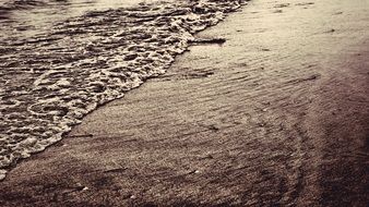 soft waves splashing on sand beach, korea