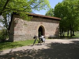 bike near the chapel on a sunny day