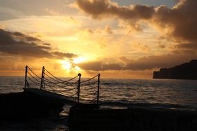 yellow sunset in the clouds over the coast of Mallorca