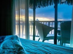 bungalow sunrise over water window view