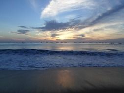 sandy ocean beach at sunset