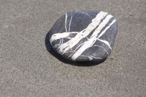 gray round stone with white stripes