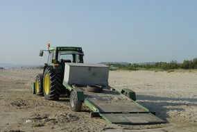 green tractor for beach cleaning