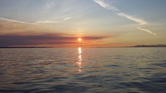 distant view of the sunset over the ocean coast