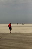 man stands on the beach