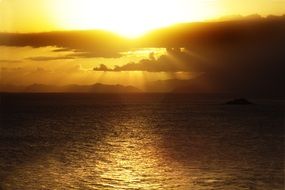 golden rays of sunset over the sea