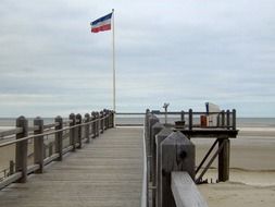 beach pier and flag