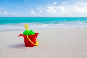 children's toys on a tropical beach