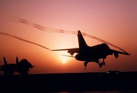 two fighters on the background of colorful sunset