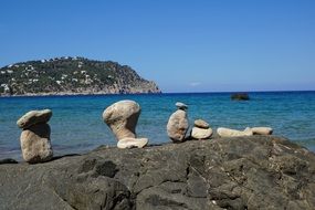 stones on rocky beach on ibiza island