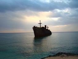ship silhouette at sea at dusk