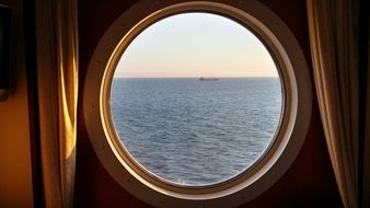 view from the porthole of the cruise liner