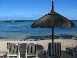 beach umbrella and beach chairs