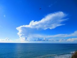 white clouds over seascape