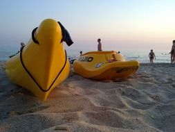 kayaks on the beach on the beach in the evening