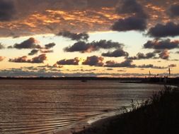 clouds in the sky above a lake in poland