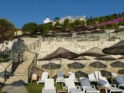 beach seats on the beach by the castle wall