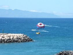 parachute over the ocean off the coast of europe