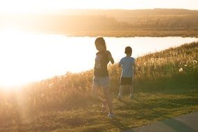Happy children by the lake in Canada