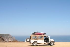 surfboards on the SUV on the beach in Portugal