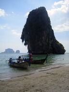 boats on the shore of a tropical island