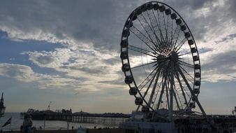 ferris wheel on pier at sunset, uk, england, brighton