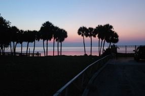 dark coast, blue and purple sky and water at dusk, usa, florida