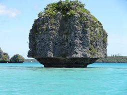 rocky island in the lagoon in New Caledonia