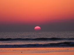 landscape of pink sunset over a calm ocean