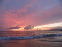 waves on the beach at sunset