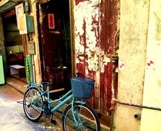 bike with a basket near the wall in hong kong