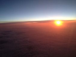 red sunset from aeroplane window scene