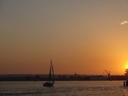 sailing boat in the ocean on a sunset background in San Diego