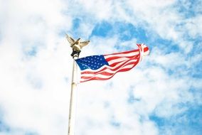 American flag in the cloudy sky