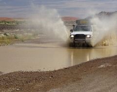 all-terrain vehicle rides on the road