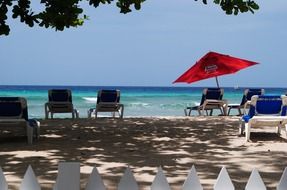 beach with sun loungers and parasols