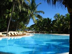 loungers by the pool for relaxing